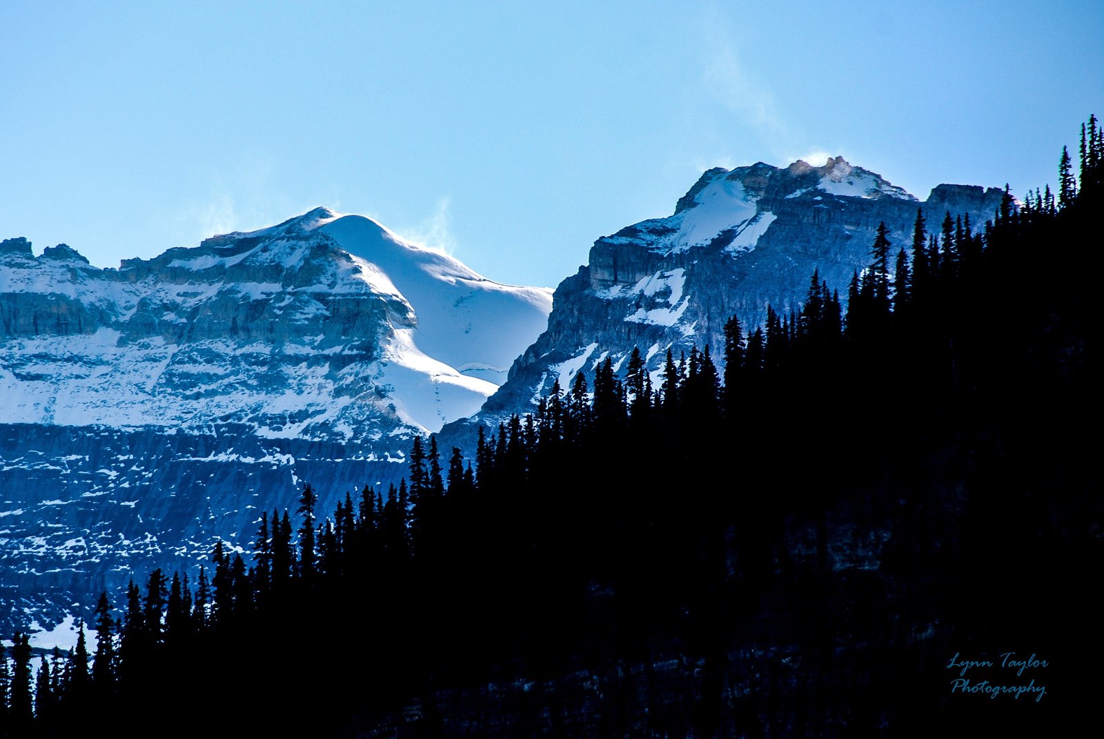 Blue Mountain Landscape with Snow-Covered Peaks